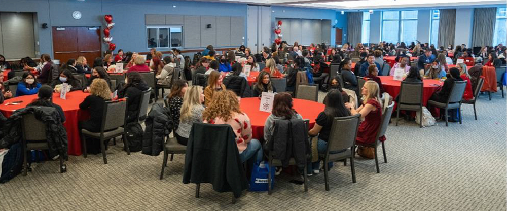 Room full of high school students listening to lecture